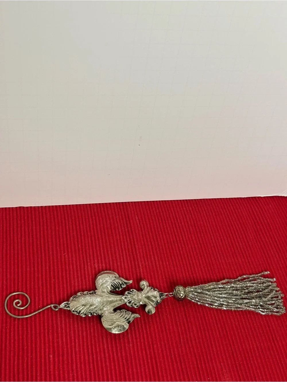 Metal Fleur-de-Lis Hanging Ornament with Silver tone Tassel